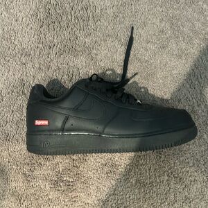 Supreme black Air Force 1s